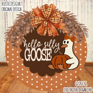 May include: A round orange sign with white polka dots featuring a brown scalloped center, a plaid bow, and a white goose holding an orange pumpkin. The text reads hello silly GOOSE. The design includes brown foliage and RUSTICDESIGNKY ORIGINAL DESIGN.
