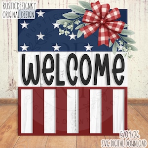May include: A wooden sign with a patriotic theme. The top section is blue with white stars, the middle section has the word "WELCOME" in large black letters, and the bottom section has red and white stripes. A red and white checkered bow and greenery are at the top.