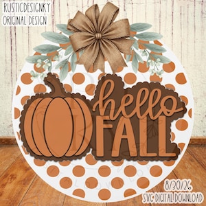 May include: A round wooden sign featuring a white background with orange polka dots, a large orange pumpkin, and the brown text "hello FALL". The sign is decorated with green leaves and a large brown burlap bow at the top. Text reads "RUSTICDESIGNKY ORIGINAL DESIGN" and "8/30/26 SVG DIGITAL DOWNLOAD".