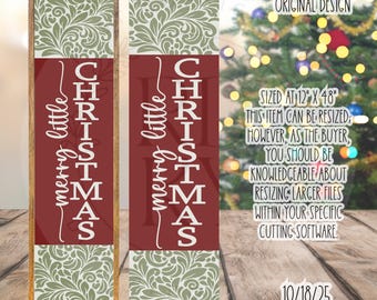 May include: A wooden sign with a red central panel displaying "merry little CHRISTMAS" in white script. The top and bottom sections have a green floral design. The sign is 30 cm wide and 122 cm tall.