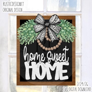 May include: A rectangular wooden sign with a black background and the words "home sweet HOME" in white. The sign is decorated with a bow, greenery, and a string of beads. The top left corner reads "RUSTICDESIGNKY ORIGINAL DESIGN".
