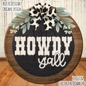 May include: A round wooden sign with the words "HOWDY y'all" in white lettering on a black background. The sign is decorated with a black and white cow print bow and green leaves. The sign also includes the text "RUSTICDESIGNKY ORIGINAL DESIGN" and "2/02/26 SVG DIGITAL DOWNLOAD".