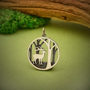 Sterling silver Deer in Trees layered charm. 26 x 20 mm. Includes jump ring.