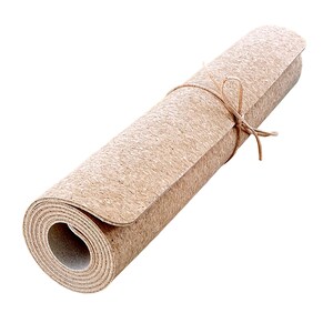 May include: A rolled up cork yoga mat tied with twine. The mat is a natural brown color.