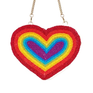 May include: A rainbow heart-shaped beaded purse with a gold chain strap.