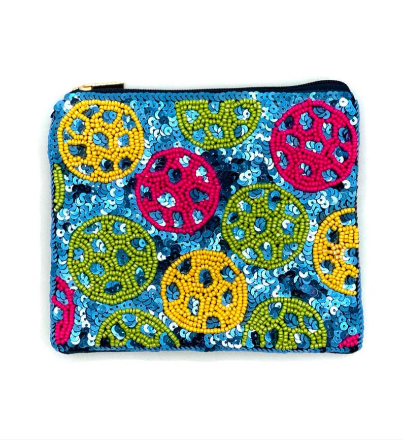 May include: A blue zippered pouch with a colorful beaded design. The pouch is decorated with circles of yellow, green, pink, and blue beads.