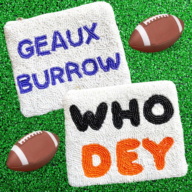 May include: Two white beaded pouches with different phrases. The top pouch has the words "GEAUX BURROW" in purple beads. The bottom pouch has the words "WHO DEY" in black and orange beads. Two brown footballs are on either side of the pouches.