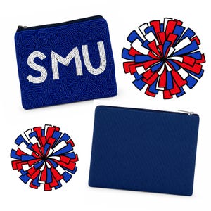 May include: A blue beaded pouch featuring the white text SMU, a plain blue fabric pouch with a zipper, and two circular pom-poms with red, white, and blue strips. The beaded pouch has a dark zipper closure along the top edge.