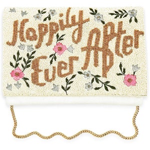 May include: A white beaded clutch with a gold chain strap. The clutch is decorated with gold beads that spell out "Happily Ever After" and pink and white floral embroidery.