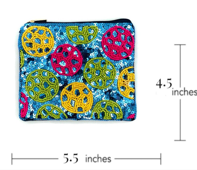 May include: A small, blue, beaded coin purse with a zipper closure. The purse is decorated with colorful circles of sequins and beads. It measures 5.5 inches wide and 4.5 inches tall.