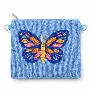 May include: A light blue beaded coin purse with a zip closure and a colourful butterfly design. The butterfly has orange, pink, yellow, and green accents. The purse has a small blue loop on each side.