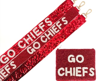 May include: Red beaded purse and three red straps with gold-colored clasps. The straps and purse feature the text "GO CHIEFS" in white beads. The straps have a sequined design.