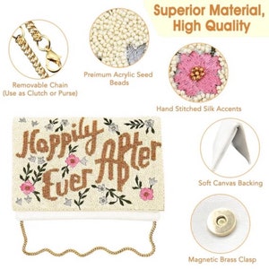 May include: A white beaded clutch with a gold chain strap. The clutch is decorated with the words "Happily Ever After" in gold beads and pink and white flowers. The clutch has a soft canvas backing and a magnetic brass clasp.