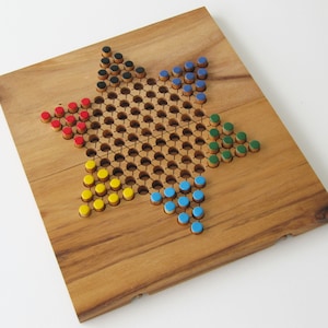 Dames Chinoises jeu de société de 2 à 6 joueurs en bois massif écoresponsable, normes CE. Marque française Ledelirant, plateau refermable.