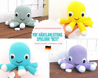 May include: Four crocheted octopus toys in different colors: gray, yellow, blue, and purple. Each octopus has white and black eyes, a smiling mouth, and white-tipped tentacles. The image includes text that reads "PDF-HÄKELANLEITUNG SPIELUHR 'OCTI'".