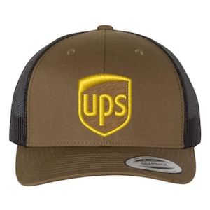 May include: A brown trucker hat with a black mesh back and a curved brim. The front of the hat features the UPS logo embroidered in gold. The hat has a snapback closure for adjustable sizing.
