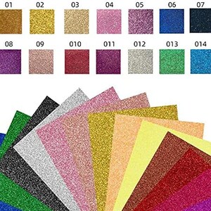 K&ouml;nnte beinhalten: Sortiment von 14 Glitzer-Kartonb&ouml;gen in verschiedenen Farben, darunter Gold, Silber, Rosa, Rot, Gr&uuml;n, Blau und Lila. Die B&ouml;gen sind f&auml;cherf&ouml;rmig angeordnet, mit den Nummern 01-14, die auf der oberen Reihe gedruckt sind.
