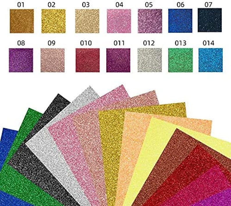 K&ouml;nnte beinhalten: Sortiment von 14 Glitzer-Kartonb&ouml;gen in verschiedenen Farben, darunter Gold, Silber, Rosa, Rot, Gr&uuml;n, Blau und Lila. Die B&ouml;gen sind f&auml;cherf&ouml;rmig angeordnet, mit den Nummern 01-14, die auf der oberen Reihe gedruckt sind.