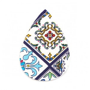 May include: A teardrop-shaped earring with a colorful, patterned design. The pattern features a white background with blue, yellow, and red floral and geometric elements, framed by dark blue lines. The earring is a unique accessory.