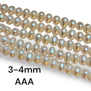 May include: Strands of creamy white pearls, each 3-4mm in size, are displayed against a white background. The pearls have a lustrous sheen and are arranged in neat rows. The text "3-4mm AAA" is visible at the bottom.