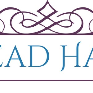 May include: A logo with the words "A BEAD HABIT" in a blue, stylized font. The text is set on a white rectangular banner with a purple border and ribbon extensions. An ornate purple flourish design sits above the banner.