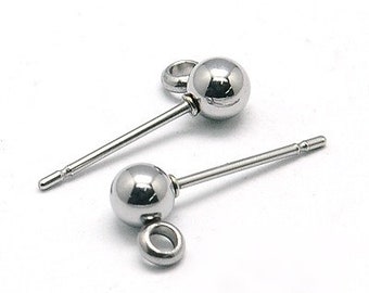 May include: Two silver-colored stud earrings with a spherical design and a post for piercing. Each earring has a small loop attached below the sphere. The earrings are displayed on a white background.