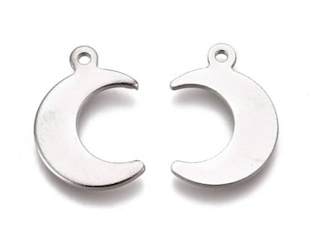May include: Two silver-colored crescent moon charms with a small hole at the top for stringing. The charms are made of a shiny metal and are identical in shape and size. These charms are suitable for jewelry making.