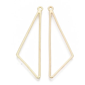 May include: Two gold-colored, geometric pendant charms. Each charm is a slender, open-frame design in the shape of a long, asymmetrical triangle. The top of each charm has a small loop for attaching to a chain or other jewelry component.