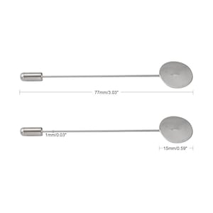 May include: Two silver-colored lapel pins. Each pin has a cylindrical end, a long, thin stem, and a circular flat head. The pins are 3.03 inches long, and the circular head is 0.59 inches in diameter.