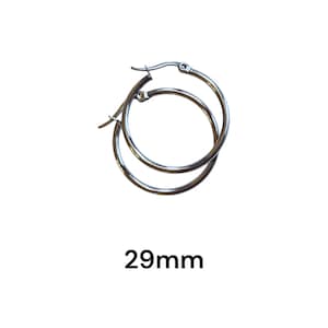May include: A pair of silver hoop earrings. The earrings are 29mm in diameter. The hoops are round and have a simple, classic design. The earrings are shown against a white background.