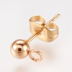 May include: A single gold-colored earring post with a round ball at the end and a small loop. The earring post has a butterfly backing. The earring is designed for jewelry making.