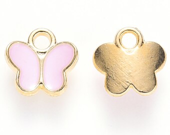 May include: Two butterfly-shaped charms. One charm is gold-colored with a light pink butterfly design. The other charm is gold-colored and flower-shaped. Both charms have a small loop at the top for attaching to jewelry.