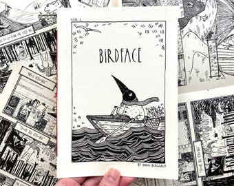 May include: Black and white illustration of a bird-faced character in a boat on water, with the title "BIRDFACE" at the top. The image is from "Issue 2" and is signed by Hana Berggren. Other comic panels are visible in the background.