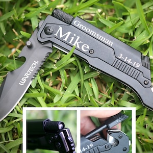 May include: Black multi-tool pocket knife with a serrated blade, bottle opener, and a safety cutter. The knife has a black handle with the words "Groomsman Mike 3-14-19" engraved on it.