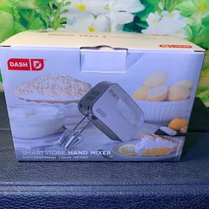 Hand Mixer- NEW Hand Mixer with Three Speeds and Built in Beater Storage NEW in Original Box!
