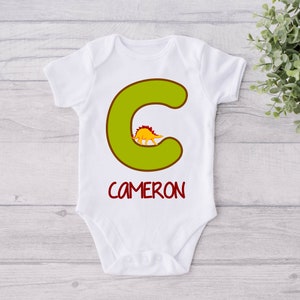 Personalized Baby Name and Initial Onesie® - Custom Baby Initial and Name Bodysuit - Cute Dinosaur Baby Text Onesie® - Gift for Niece/Nephew