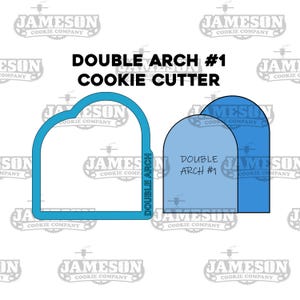 May include: A blue cookie cutter shaped like a double arch. The cutter is labeled "Double Arch #1".