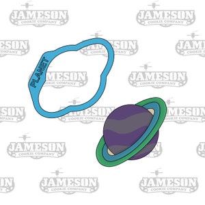 May include: A blue cookie cutter shaped like a planet with the word "PLANET" written on it. A purple and blue planet cookie cutter with a ring around it.