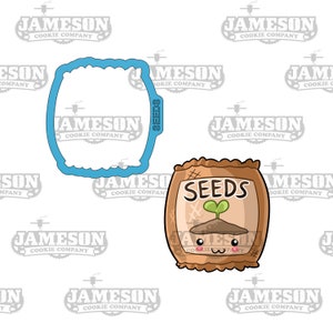 May include: A brown and white cartoon seed packet with a smiling face and the word "SEEDS" printed on it. A green sprout is growing out of the top of the packet.