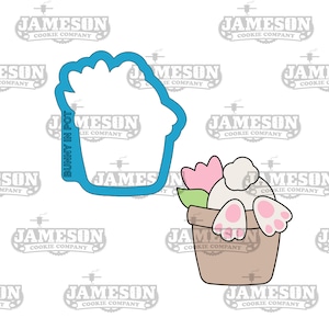 May include: A blue cookie cutter in the shape of a flower pot with a white bunny rabbit inside. The bunny has pink ears and feet. The bunny is sitting in the pot with a pink flower and green leaves.