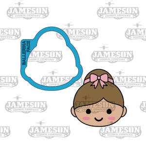 May include: A blue cookie cutter in the shape of a ballerina's face with the words "Ballerina Face" on the side.  A cartoon illustration of a ballerina's face with brown hair, a pink bow, and a pink blush on her cheeks.