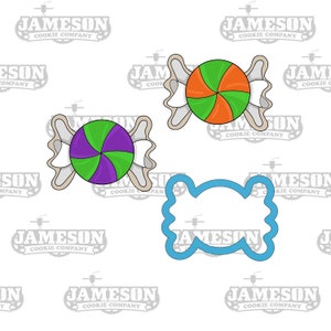 May include: Three cookie cutters: two are shaped like a candy with a swirl design, one is green, purple, and orange, the other is green and purple, and the third is a simple candy shape.