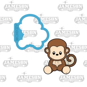 May include: A blue cookie cutter shaped like a monkey with the word "MONKEY" written vertically on the left side. A brown cartoon monkey with a light brown tail is sitting on the right side of the image.
