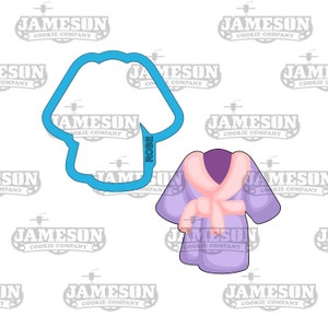 May include: A blue cookie cutter and a cartoon illustration of a purple dressing gown with a pink collar and belt. The word "ROBE" is printed on the cookie cutter.