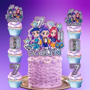 May include: A set of cake and cupcake toppers featuring cartoon characters, the name EVELYN, the number 7, a diamond, stars, a cat face, and a soda can graphic. The toppers are displayed on a frosted purple cake and several purple frosted cupcakes.