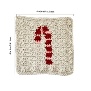May include: A 6-inch square crochet coaster with a red and pink candy cane design. The coaster is made with a beige yarn and has a textured border.