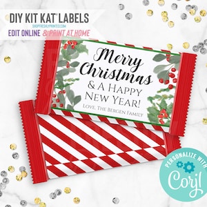 May include: Printable DIY Kit Kat labels featuring a red and white striped background with a green holly and berry design. The text reads "Merry Christmas & A Happy New Year! Love, The Bergen Family".