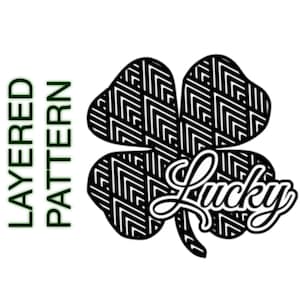 May include: Black and white layered pattern of a four-leaf clover with the word "Lucky" in a stylized font.