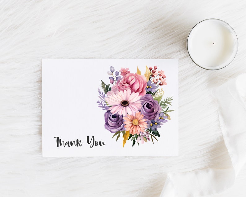 May include: A white card with a watercolor bouquet of pink, purple, and yellow flowers. The text "Thank You" is printed in black at the bottom of the card.