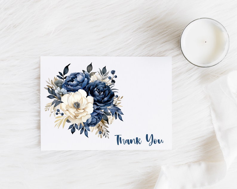 May include: A white card with a navy blue and gold floral bouquet and the text "Thank You".